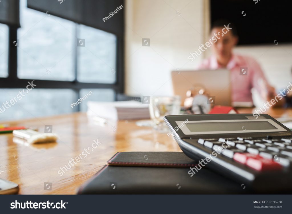 stock photo business colleagues are discussing in the conference room with documentation about the loan to 702196228 Red Apple Solutions